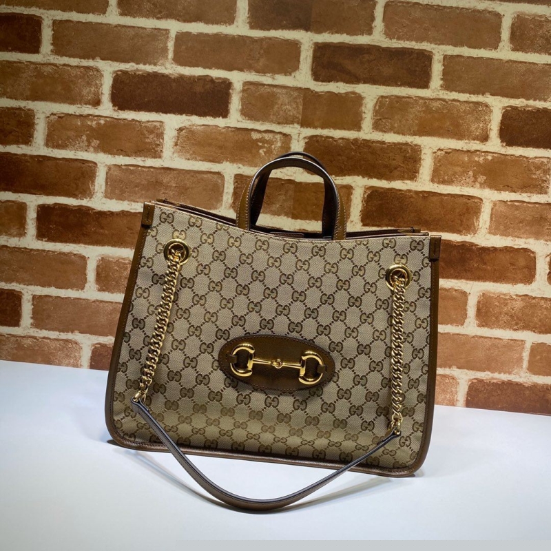 G*u*i shopping bags